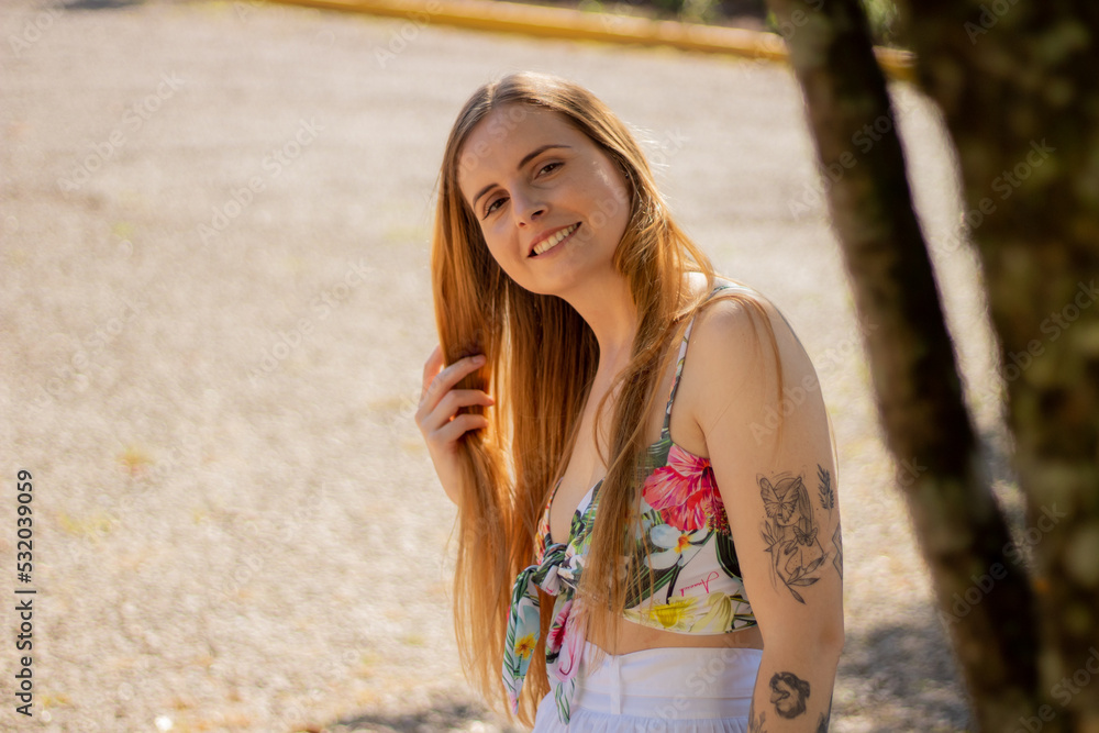 Naklejka premium Beautiful woman in the park