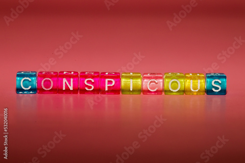 the word "conspitious" made up of cubes