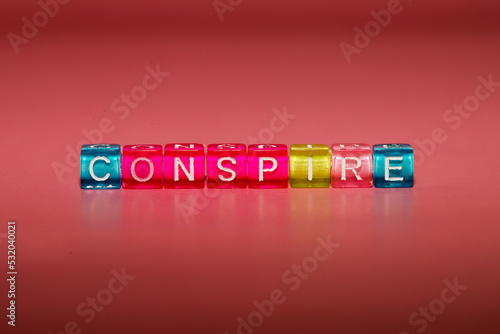 the word "conspire" made up of cubes