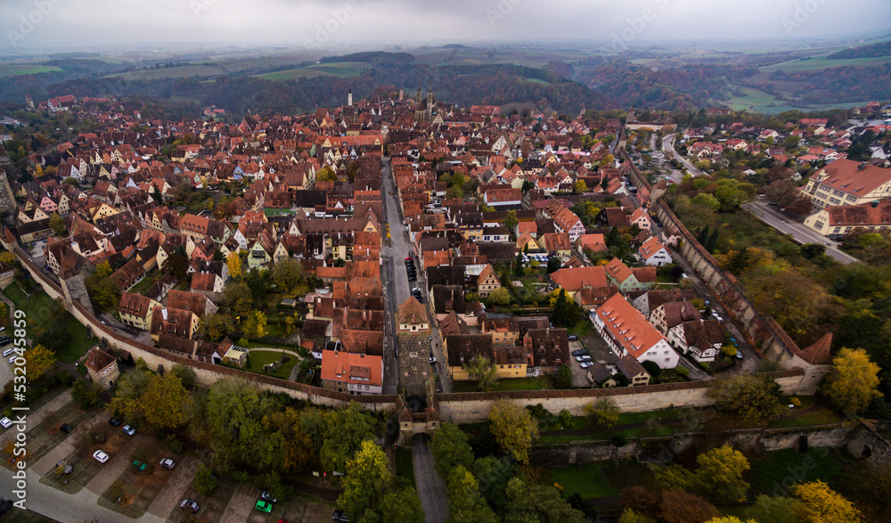 Aerial of the city Rothenburg ob der Tauber in Germany on early cloudy morning in Autumn. 