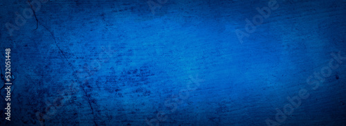 Blue background, old grunge texture, vintage painted scratched antique blue background in textured wood board design banner or distressed paper, sapphire blue color © Attitude1