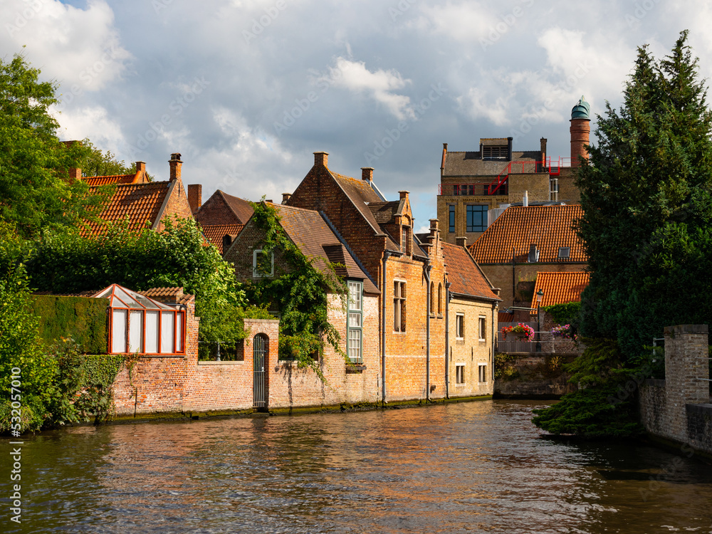 Picturesque summer landscape with views of houses and canals in the small town of Brugge, Belgium