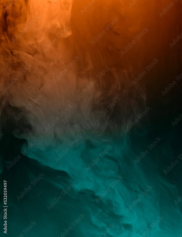 swirling clouds of turquoise and orange smoke randomly mix on a black background