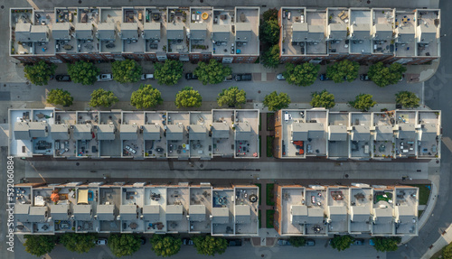 Aerial view of rows of rooftop patios on a new town house complex with garden furniture, patio umbrella in Baltimore