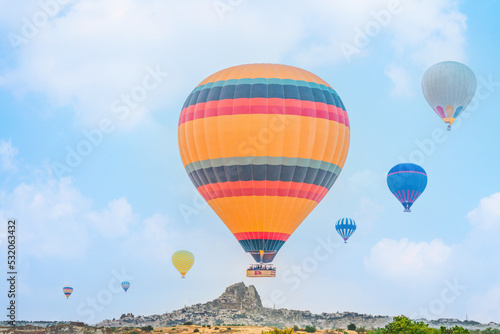 hot air balloons over Goreme town in Cappadocia Turkey © Mongkolchon