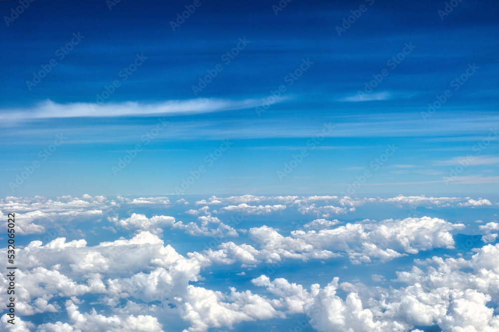 Beautiful clouds seen from an airplane for background with copyspace