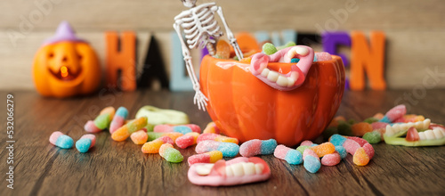 Happy Halloween day with ghost candies, pumpkin bowl, Jack O lantern and decorative (selective focus). Trick or Threat, Hello October, fall autumn, Festive, party and holiday concept © Jo Panuwat D