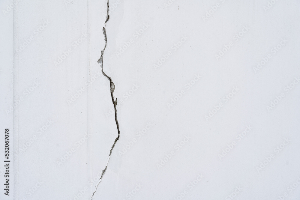 Obraz premium house broken. concrete crack. Water damage building interior. large crack white concrete wall