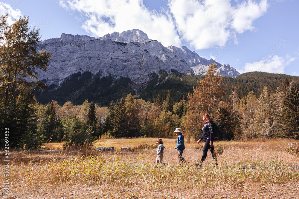 Mother and children walking in the mountains in Autumn Mother and children walking in the mountains in Autumn