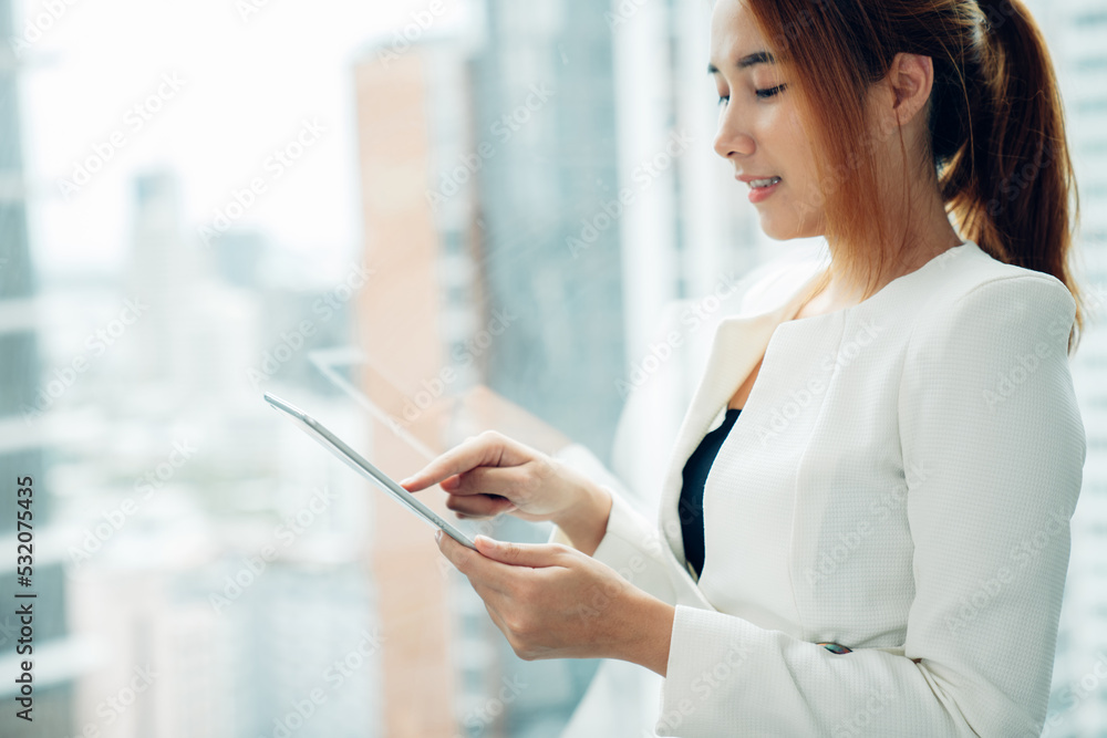 portrait of young beautiful asian woman using mobile phone in modern office. portrait of young beautiful asian woman using mobile phone in modern office.