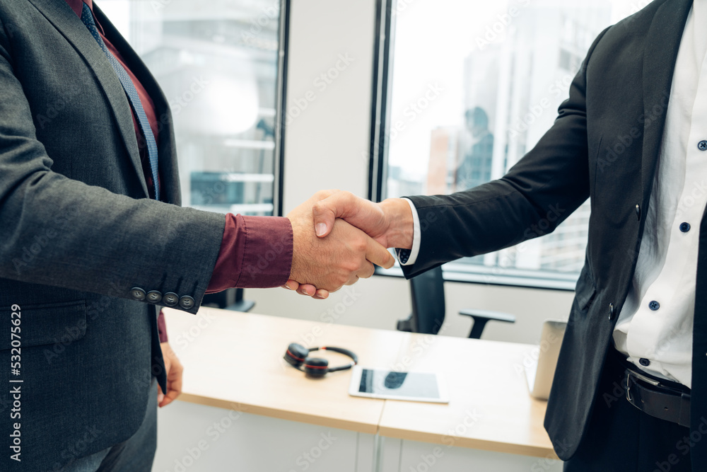 Shot crop of business people shaking hands inside office, Business meeting and partnership concepts. Shot crop of business people shaking hands inside office, Business meeting and partnership concepts.