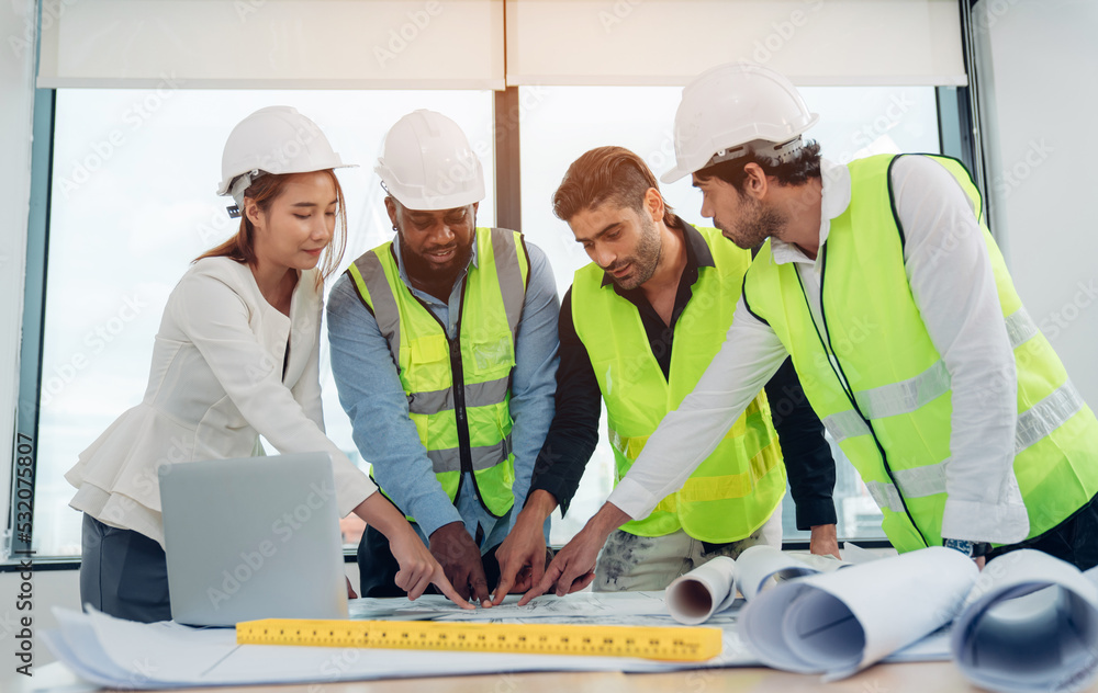 Female inspectors and architects discuss with head engineer about construction project, team discussion with construction on site work. Female inspectors and architects discuss with head engineer about construction project, team discussion with construction on site work.