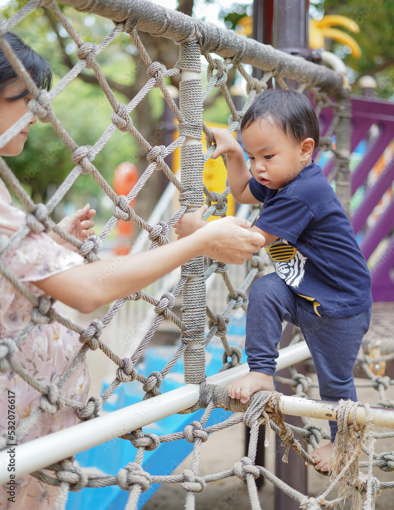 Asian Toddler Boy enjoy playing in Playground Asian Toddler Boy enjoy playing in Playground