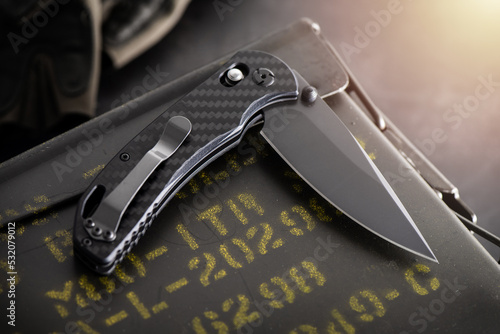 Black stainless steel folding knife photo