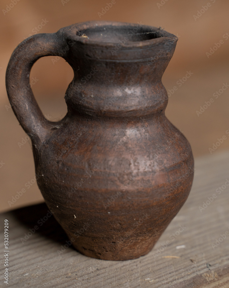 Pottery Craft. a ceramic product with your own hands, made on a Potter's wheel isolated on a white background.