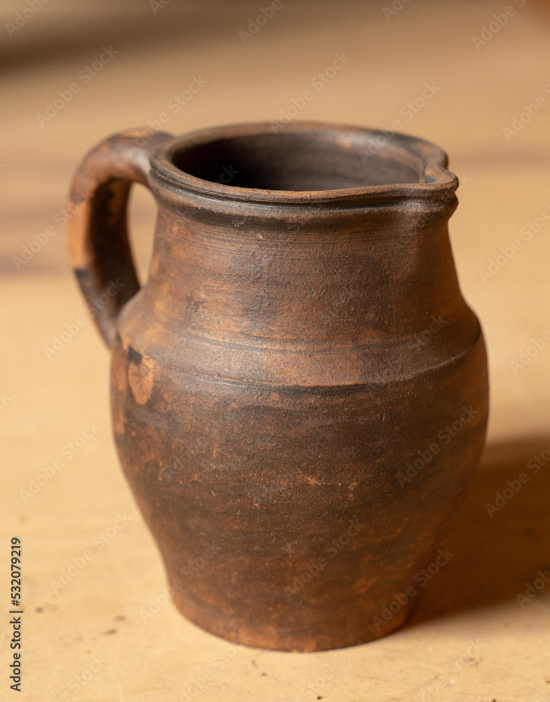 Pottery Craft. a ceramic product with your own hands, made on a Potter's wheel isolated on a white background.