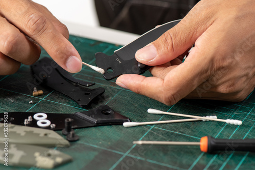 Clening a pocket knife photo