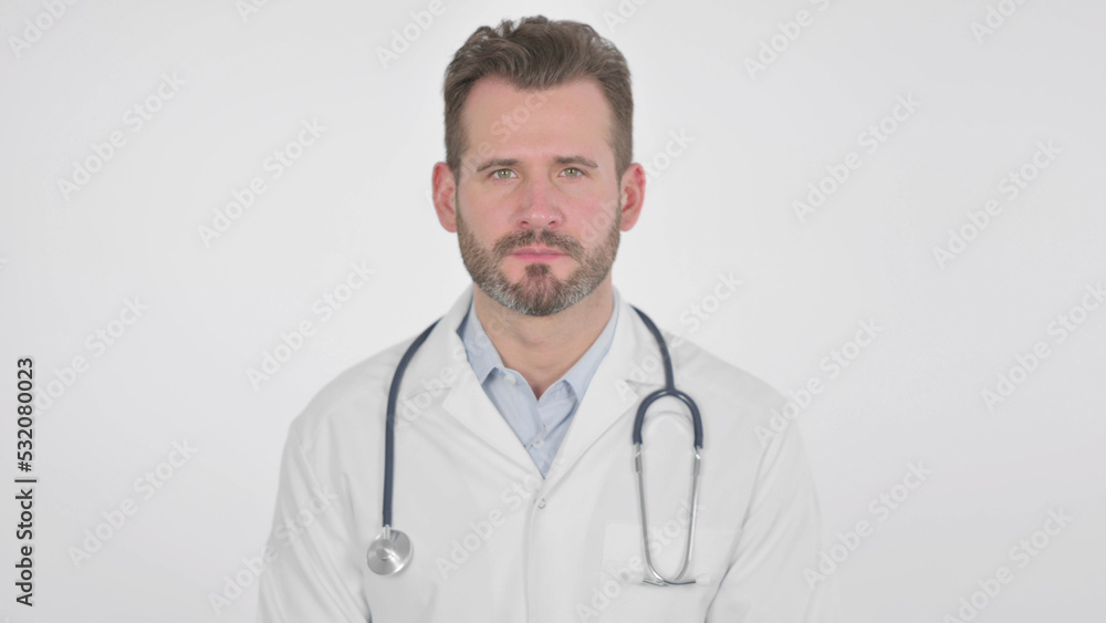Middle Aged Doctor Showing Yes Sign by Head Shake, White Background Middle Aged Doctor Showing Yes Sign by Head Shake, White Background