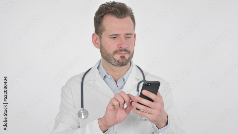 Middle Aged Doctor using Smartphone, White Background Middle Aged Doctor using Smartphone, White Background