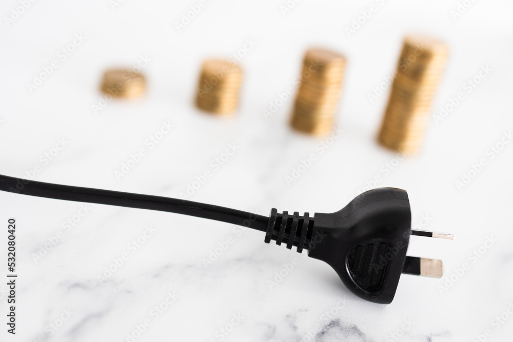 electricity costs going up, plug with growing stacks of coins in the backgroung representing prices going up electricity costs going up, plug with growing stacks of coins in the backgroung representing prices going up