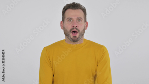 Middle Aged Man Shocked by Unbelievable Activity, White Background © stockbakers