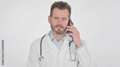 Middle Aged Doctor Talking on Smartphone, White Background