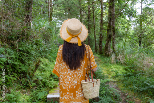 Travel woamn woman go walking in the forest photo