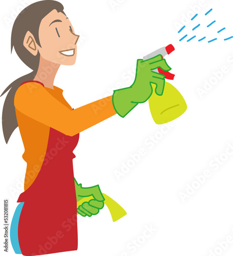 掃除で洗剤をスプレーする女性