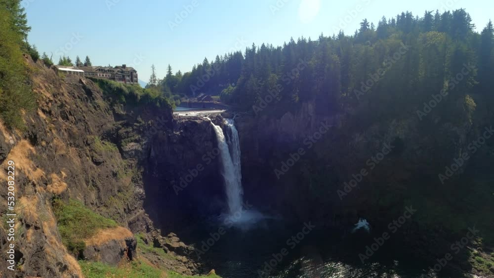 Distant view of beautiful Snoqualmie Falls a 268-foot waterfall in the northwest United States, located east of Seattle on the Snoqualmie River between Snoqualmie and Fall City, Washington. Distant view of beautiful Snoqualmie Falls a 268-foot waterfall in the northwest United States, located east of Seattle on the Snoqualmie River between Snoqualmie and Fall City, Washington.
