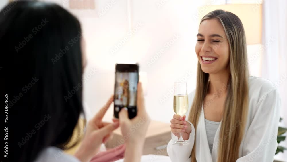 Wedding, ring and engagement with a woman or bride taking a photograph on a phone and drinking champagne with a friend. Happy, smile and celebration with an attractive young female and her bridesmaid Wedding, ring and engagement with a woman or bride taking a photograph on a phone and drinking champagne with a friend. Happy, smile and celebration with an attractive young female and her bridesmaid