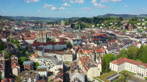 Aerial drone footage of the famous Saint Gallen historic old town with it famous Abbey of Saint Gall, now a cathedral, in Switzerland. Shot with a rotation motion.  photo