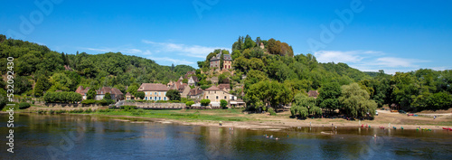 French village and Dordogne river © M.studio