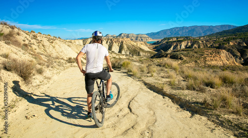 Rear view of man in bike