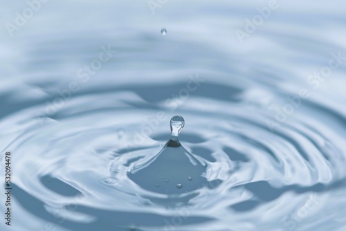 A drop of water hits the water, creating a small circular wave.