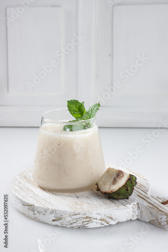 Canvastavla Jus Buah Sirsak or Soursop Juice with soursop slice.