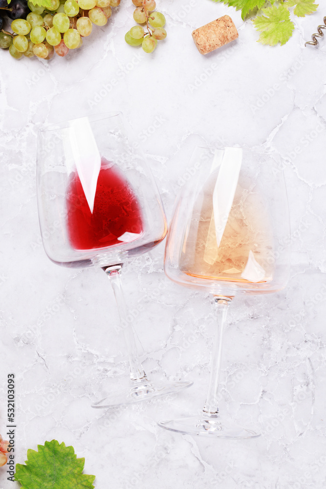 Rose and red wine glasses and grape Rose and red wine glasses and grape