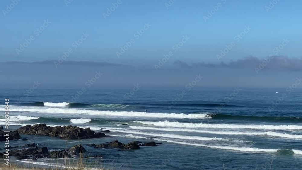 Surfing sea waves with foam on white tropical sandy beach. Viana do Castelo. Surfing sea waves with foam on white tropical sandy beach. Viana do Castelo.