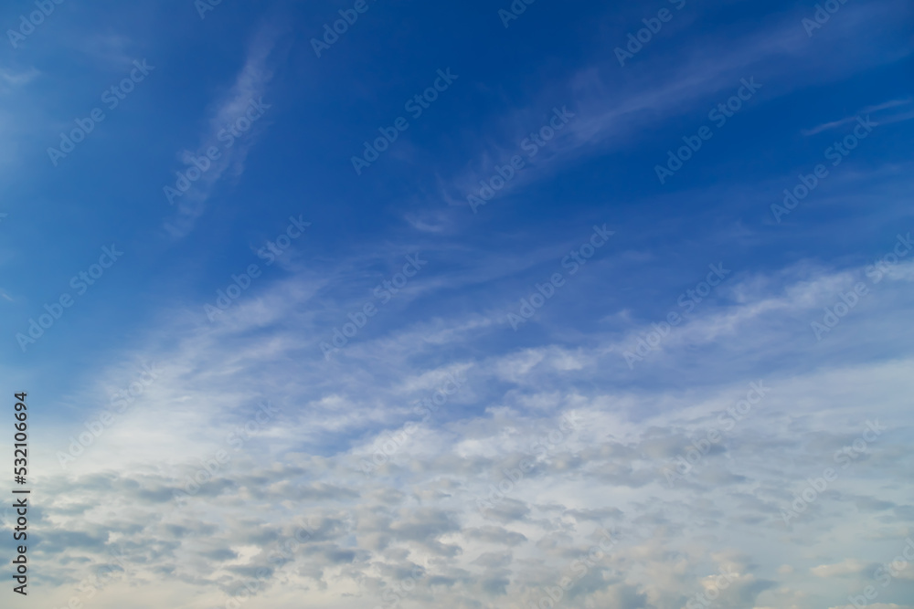 Sunny weather with cumulus and cirrus clouds on blue sky. Sunny weather with cumulus and cirrus clouds on blue sky.