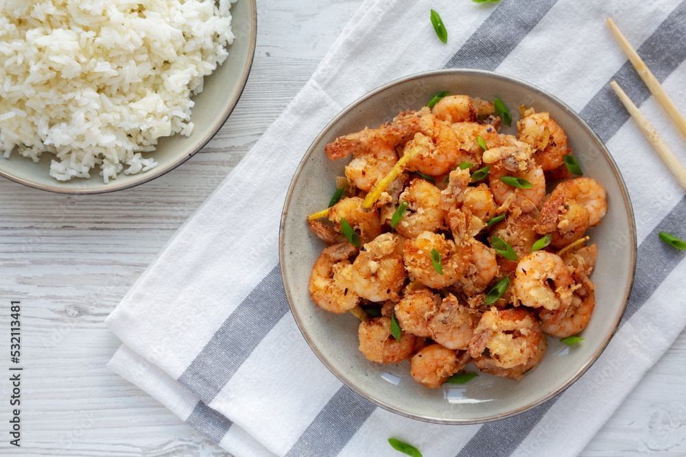 Homemade Crispy Salt and Pepper Shrimp with Scallions on a Plate, top view. Flat lay, overhead, from above. Homemade Crispy Salt and Pepper Shrimp with Scallions on a Plate, top view. Flat lay, overhead, from above.