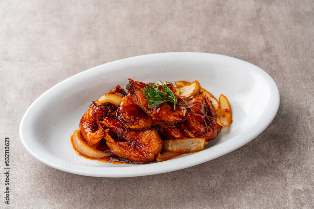 shrimp with butter sauce (Indonesia : udang saus mentega). Plating on white plate shrimp with butter sauce (Indonesia : udang saus mentega). Plating on white plate