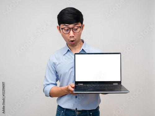 Young asian businessman feels amazed looking at laptop white screen isolated