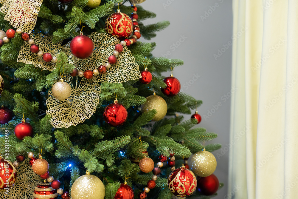 Christmas balls decorate a Christmas tree.