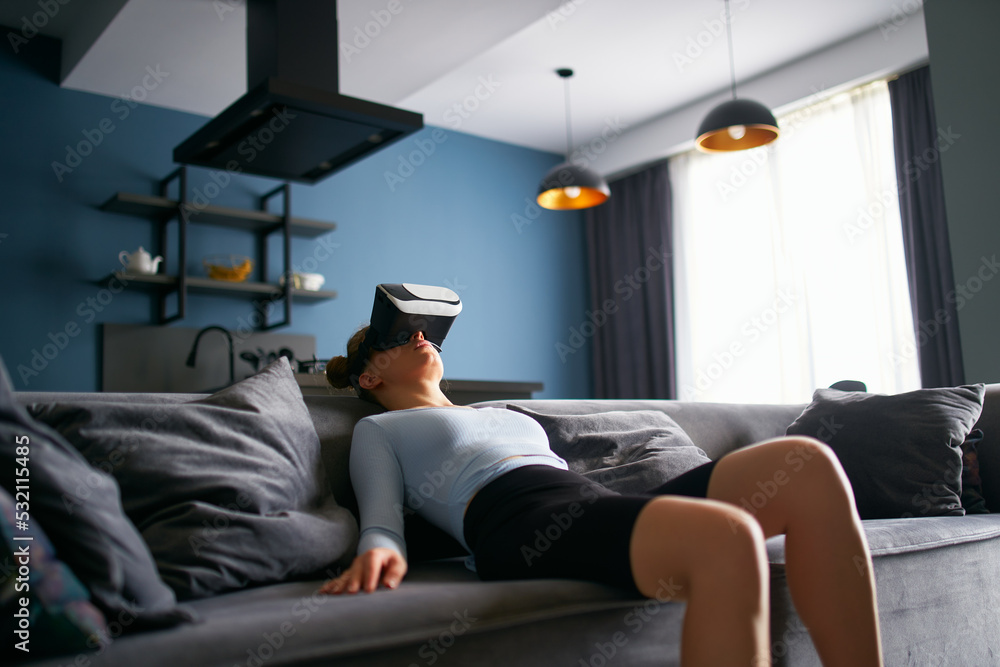 Robot like futuristic doll woman in virtual reality goggles interface