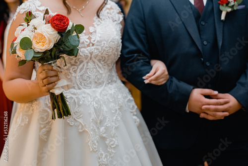 bride and groom holding hands