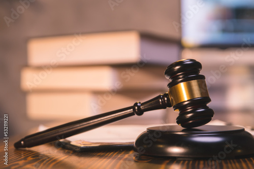 close-up The judge's hammer is placed on a wooden table in the office, the judge's hammer is used to decide the court case.