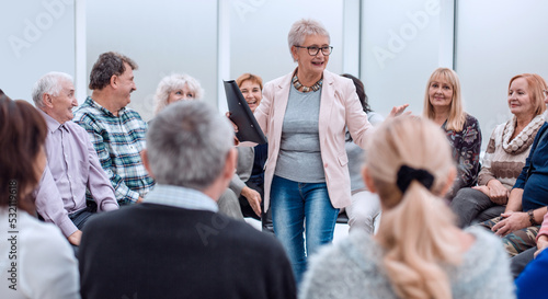 old lady teaches old people photo