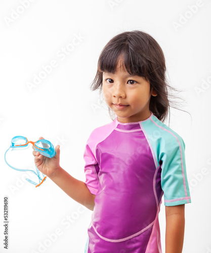 Studio photo of a girl in a swimsuit. swim goggles