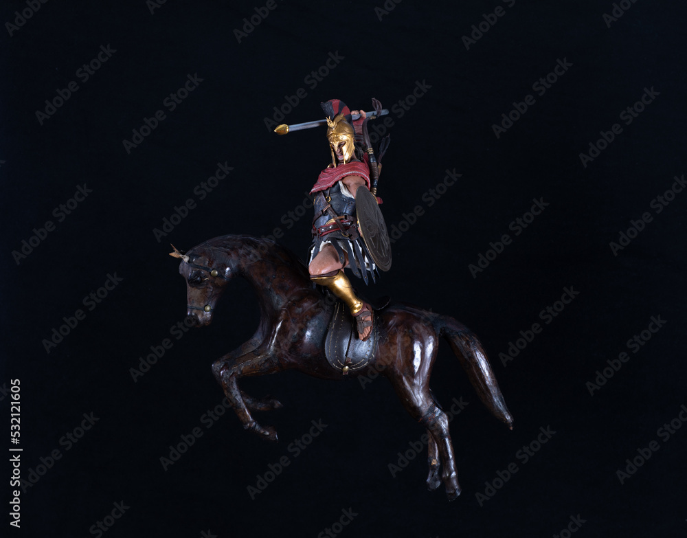 gladiator on horseback isolated on black background