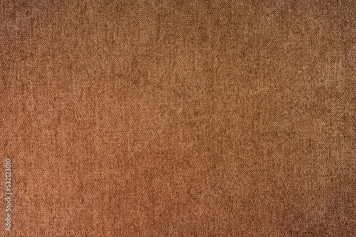 Texture background of velours brown fabric. Fabric texture of upholstery furniture textile material, design interior, wall decor. Fabric texture close up, backdrop, wallpaper.