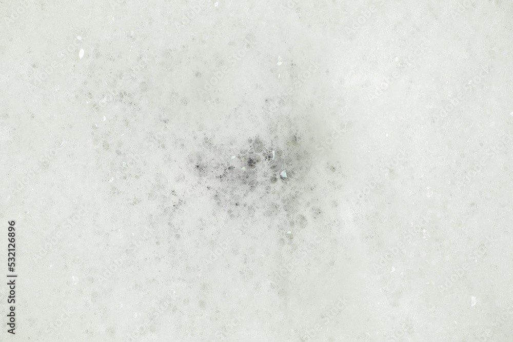 White fluffy soap foam background. Top view. White fluffy soap foam background. Top view.